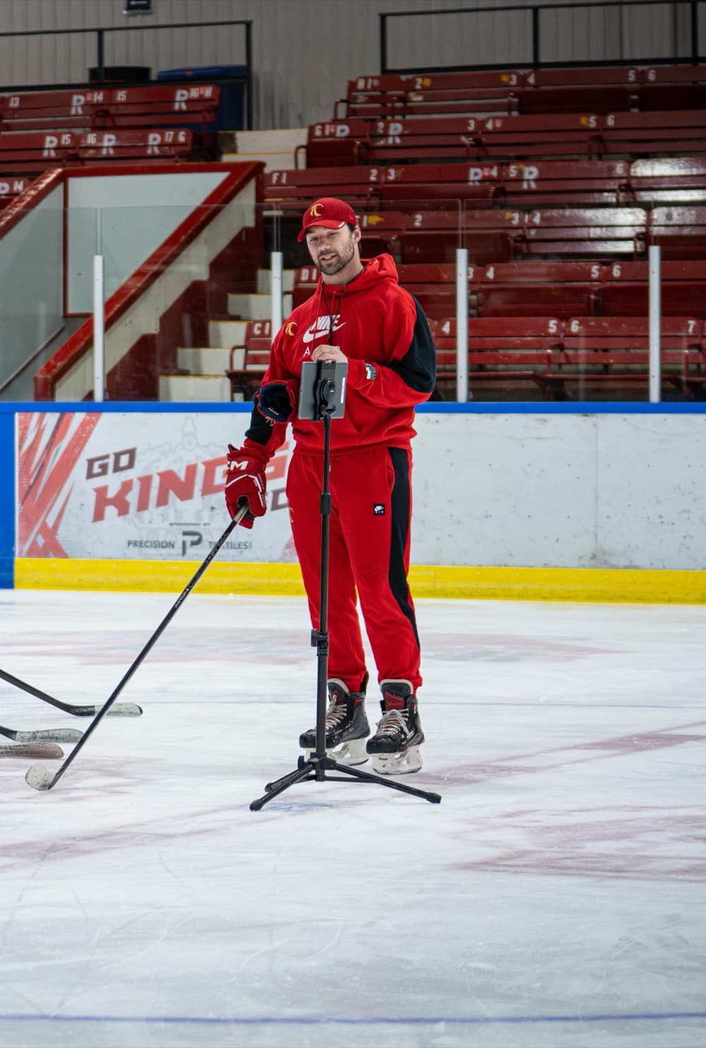 Jason Yee coaching on ice